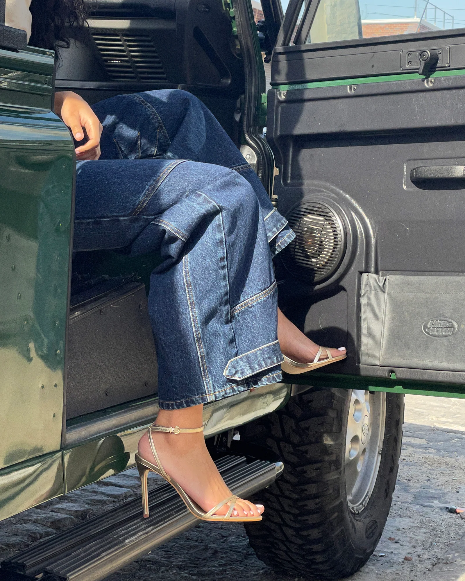 Hfxhr paired with raw wide-leg denim and Land Rover Defender